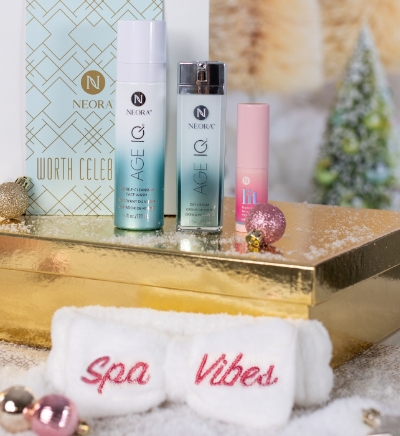 Gift of Glow skincare set, including Double Cleansing Face Wash, Day Cream and Lit Brightening Stick, with Spa Vibes headband and holiday décor.